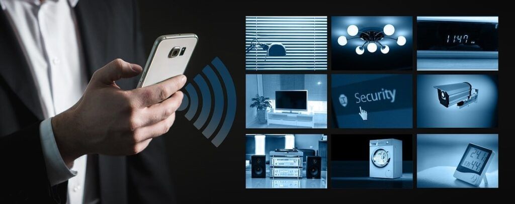 Man holding smartphone and controlling various systems and home appliances.